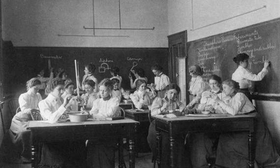 Group of young women performing atmospheric pressure experiments while studying science, circa 1890s. © Science weather engineering history